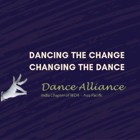 A dark blue graphic with white text reading “Dancing the Change, Changing the Dance,” featuring a stylized hand illustration and the Dance Alliance India logo beneath it.